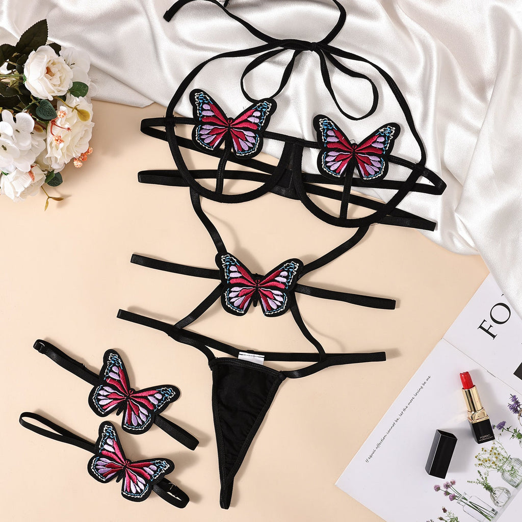 Body erótico de encaje con cuello halter, tirantes, retazos, contraste de colores, lazo y espalda descubierta